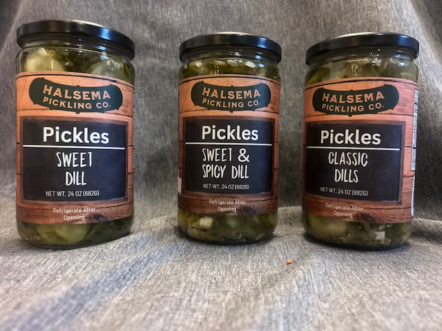 Three jars of Halsema Pickling Co. pickles side by side: Sweet Dill, Sweet and Spicy Dill, and Classic Dills